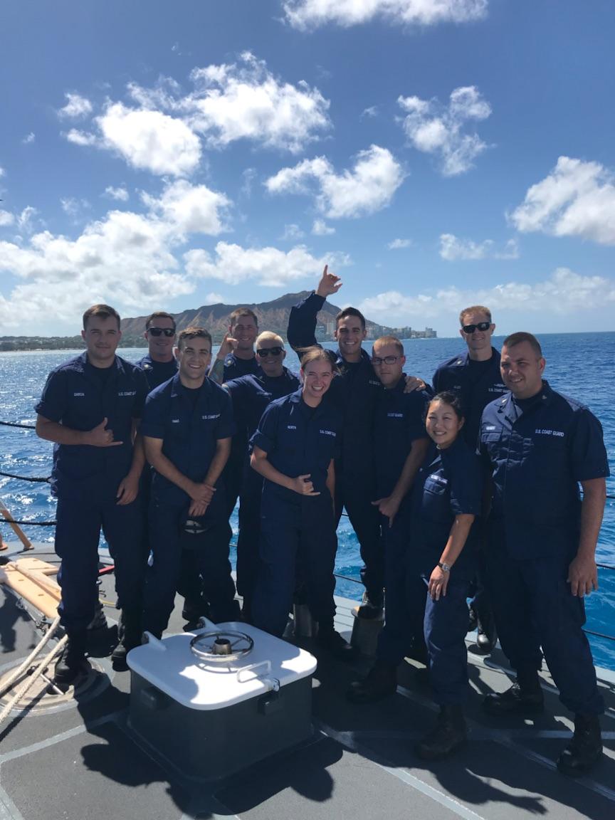 Crew of Coast Guard Cutter Kittiwake standing on deck